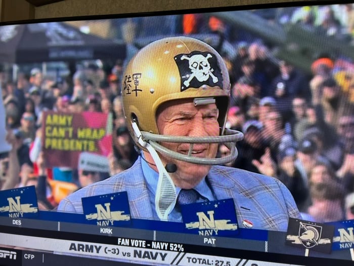 Bill Belichick wears a 1962 Navy helmet, complete with its own version of the ‘Jolly Roger,’ to make his guest pick for the Army-Navy game at Gillette Stadium.